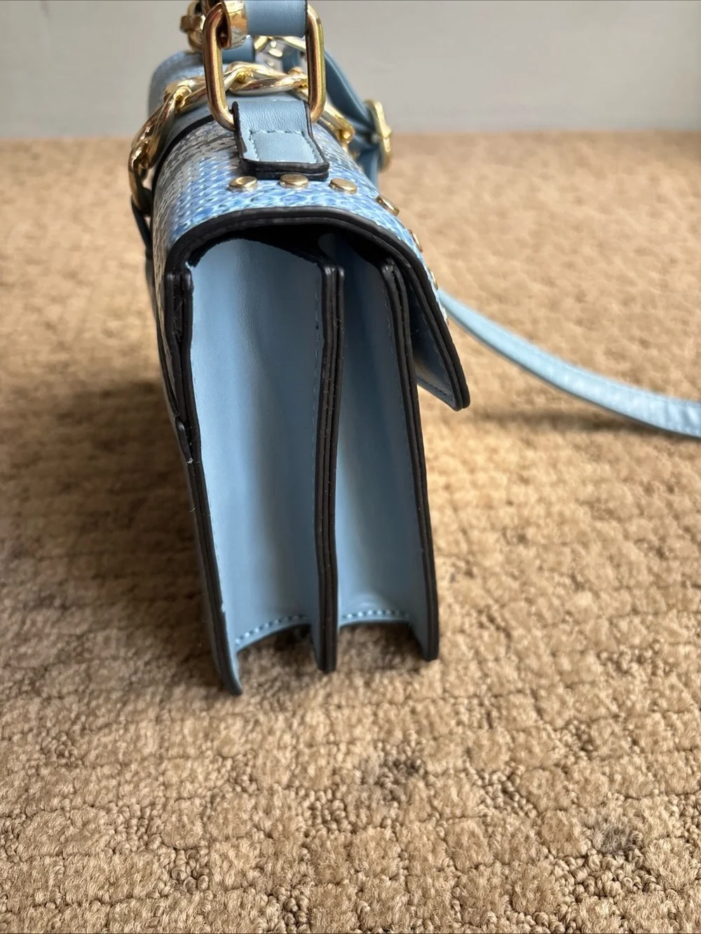 Faux snakeskin crossbody blue purse new with minor mark on bottom